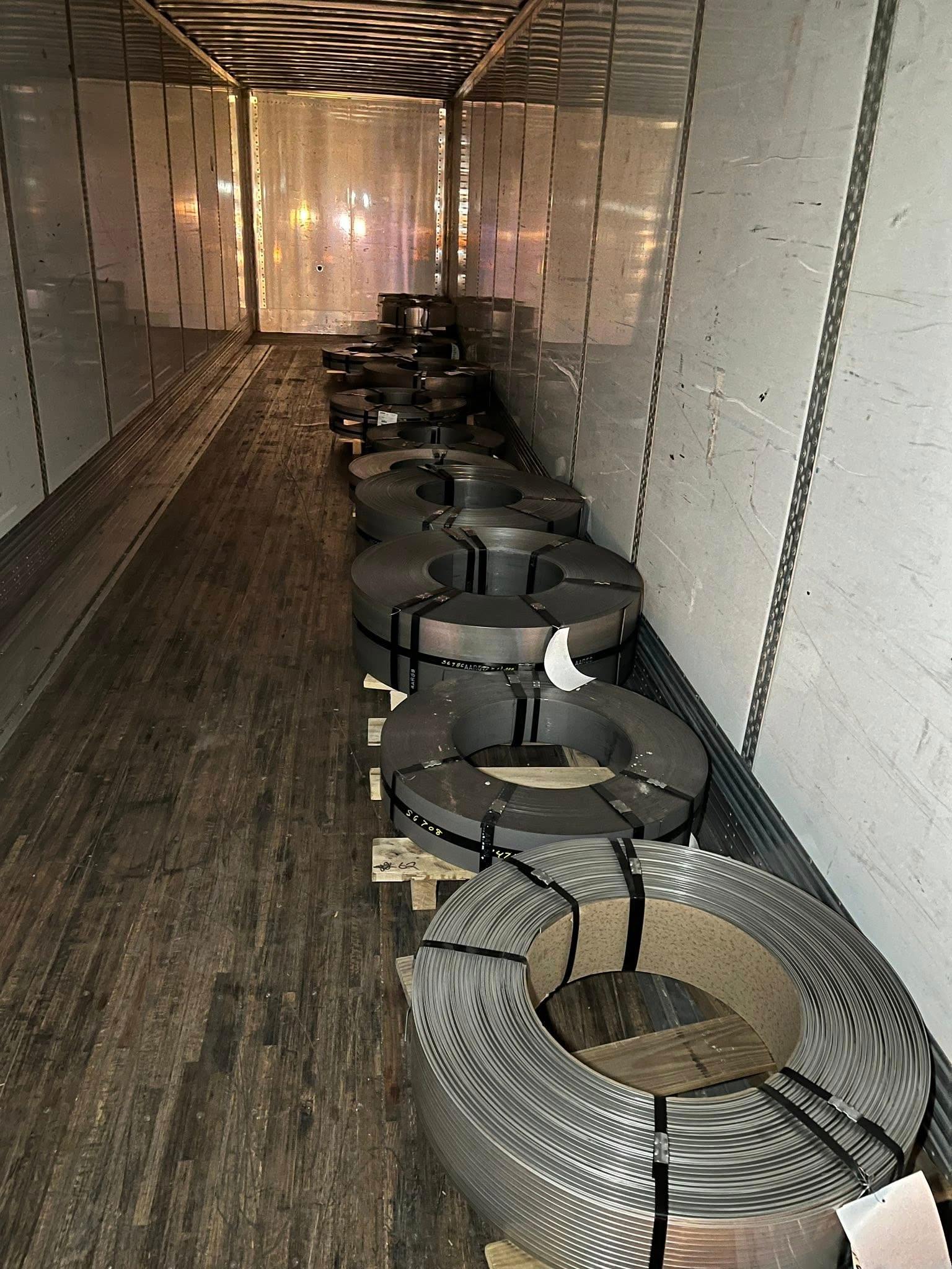 Steel coils loaded down the center — weight distribution out of compliance